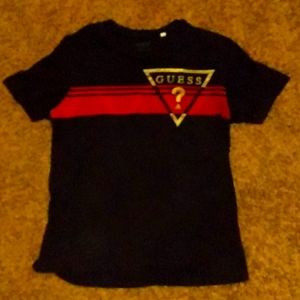 I'm selling a guess shirt it's gold red and black